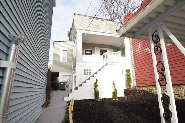 doorway to property with central air condition unit and covered porch