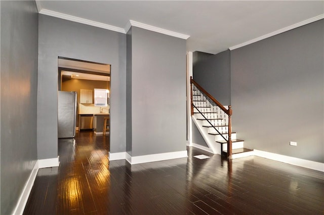 stairway with hardwood / wood-style flooring and ornamental molding