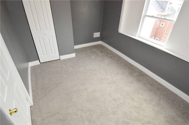 unfurnished bedroom with light carpet