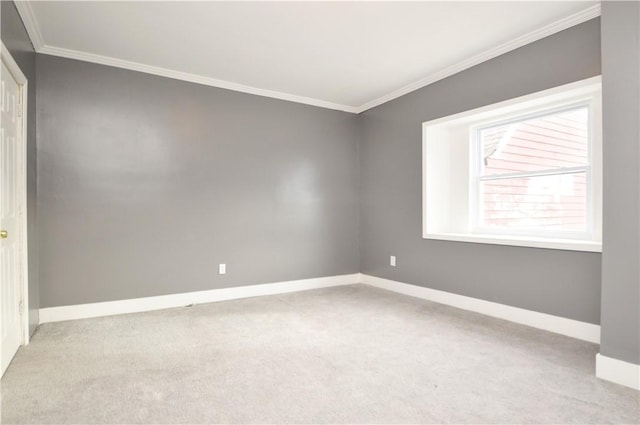 unfurnished room with light carpet and crown molding