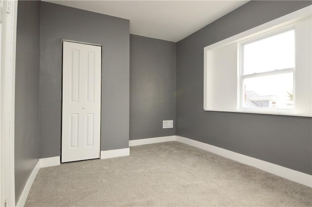 unfurnished bedroom with light carpet