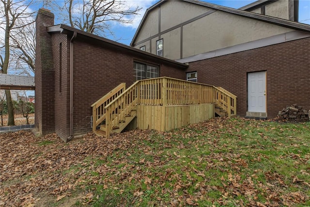 back of property with a wooden deck