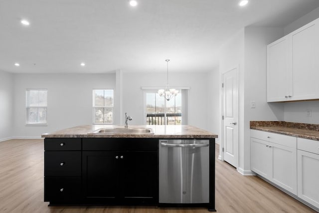 kitchen with a kitchen island with sink, sink, stainless steel dishwasher, and light hardwood / wood-style floors