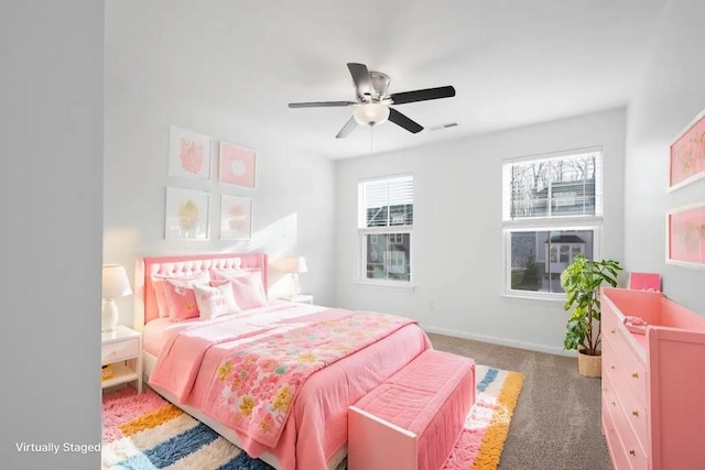 bedroom featuring dark colored carpet and ceiling fan