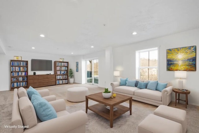 carpeted living room with plenty of natural light