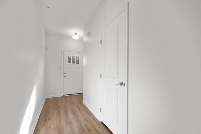 hall with light hardwood / wood-style flooring