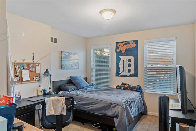 bedroom with light carpet