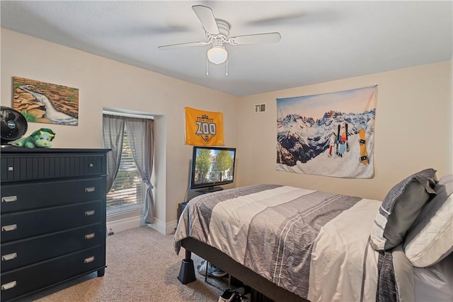 carpeted bedroom with ceiling fan