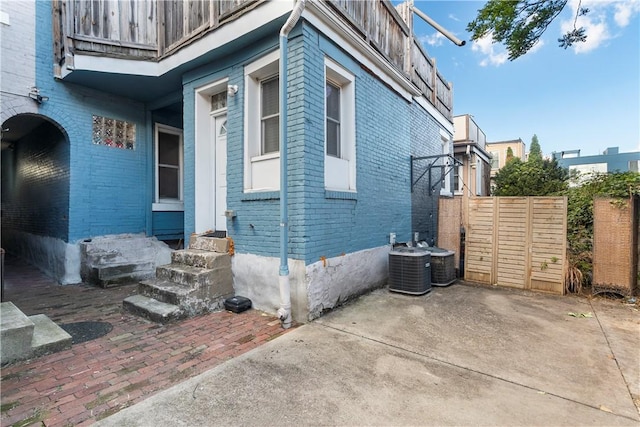 view of home's exterior with central AC unit and a patio area