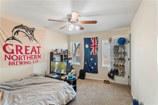 carpeted bedroom with ceiling fan