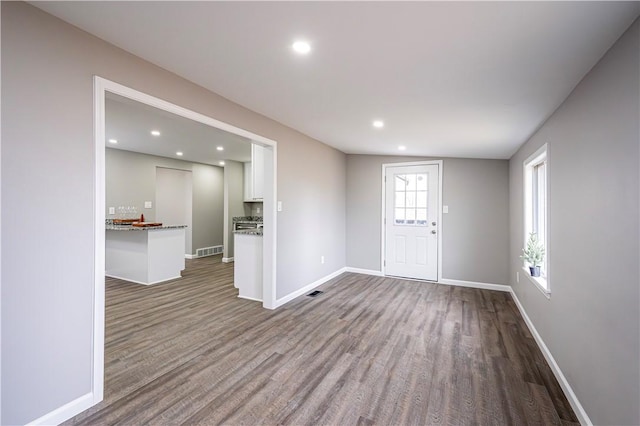 entryway with hardwood / wood-style floors and a wealth of natural light