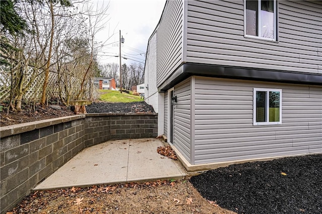 view of property exterior with a patio