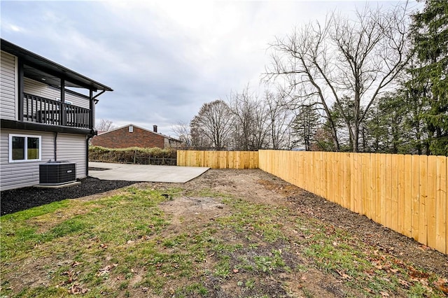 view of yard with a patio area, a balcony, and cooling unit