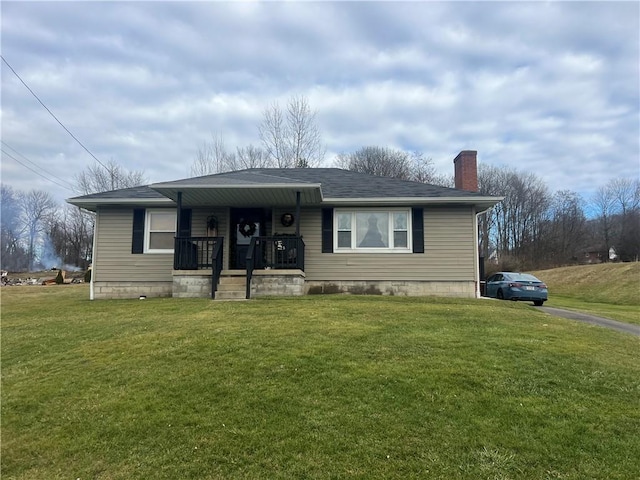 view of front of house with a front lawn and covered porch