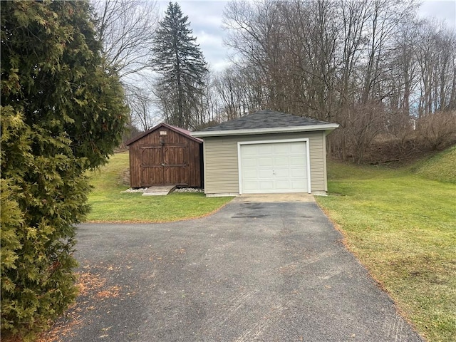 garage featuring a lawn