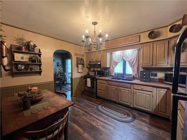 kitchen with dark hardwood / wood-style flooring, sink, a notable chandelier, and electric stove