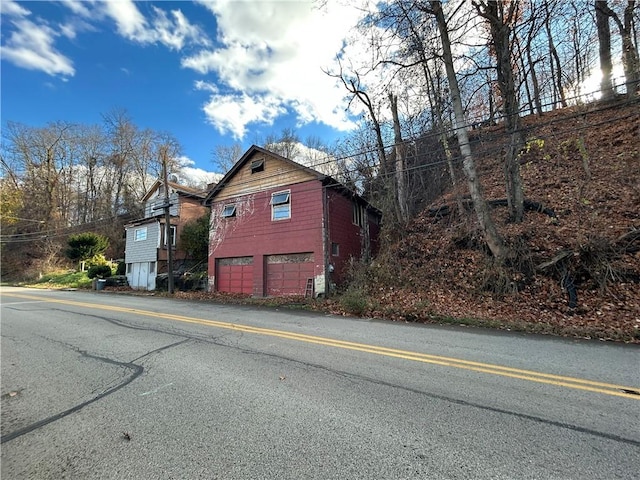 view of side of home with a garage