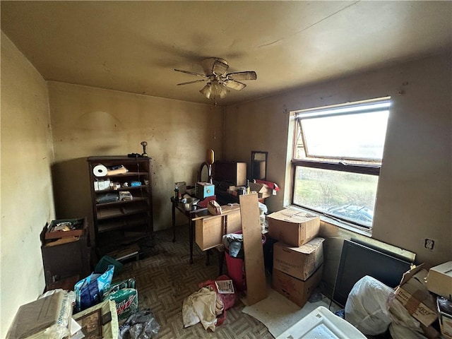 misc room with ceiling fan and parquet floors