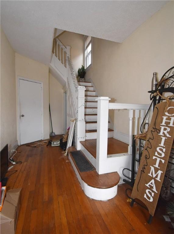 stairway with wood-type flooring