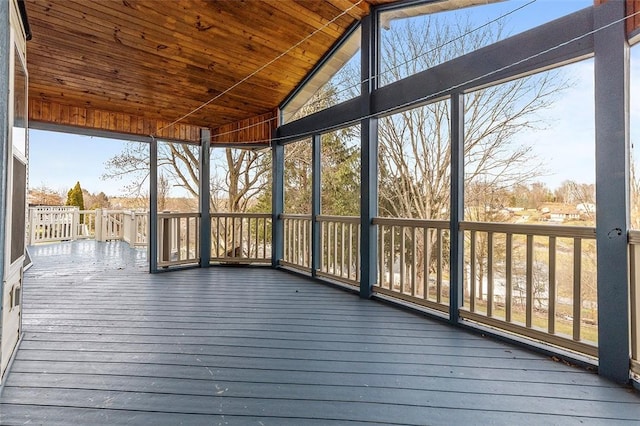 unfurnished sunroom with wooden ceiling and lofted ceiling