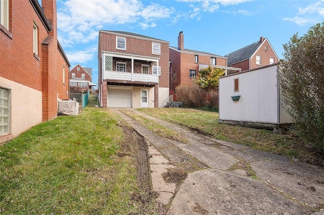 rear view of house with a yard