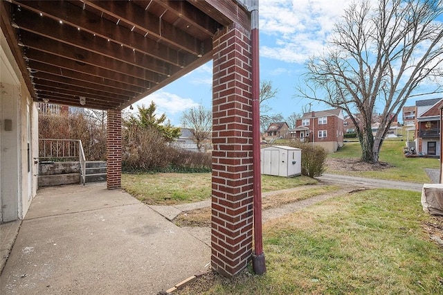 view of patio featuring a storage shed