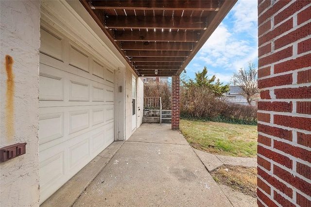 view of patio featuring a garage