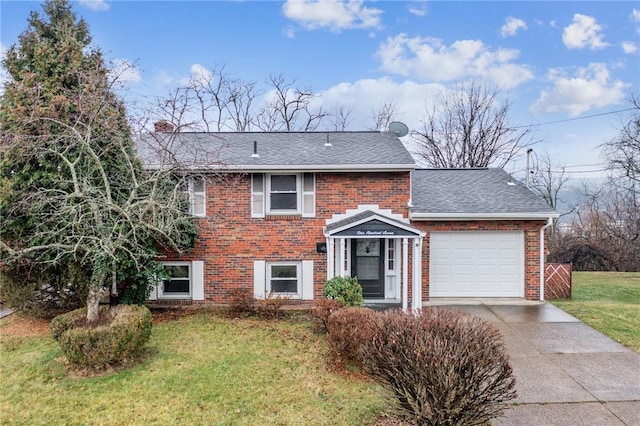 view of front of property featuring a garage, a front lawn, and brick siding