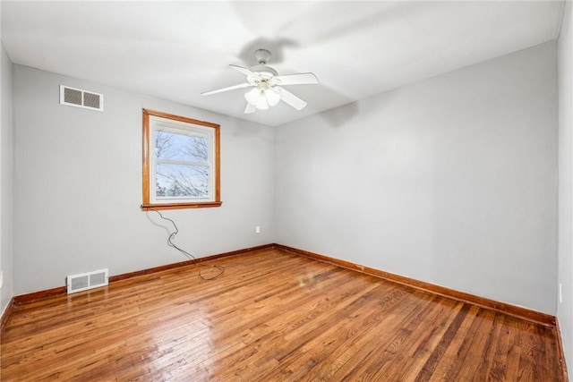 unfurnished room featuring ceiling fan and light hardwood / wood-style flooring