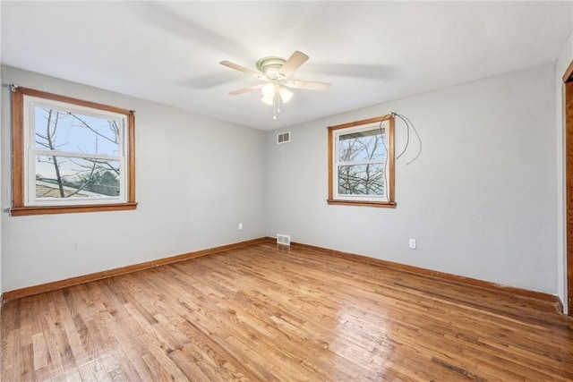 spare room with light hardwood / wood-style flooring and ceiling fan