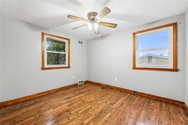 unfurnished room with hardwood / wood-style flooring and ceiling fan