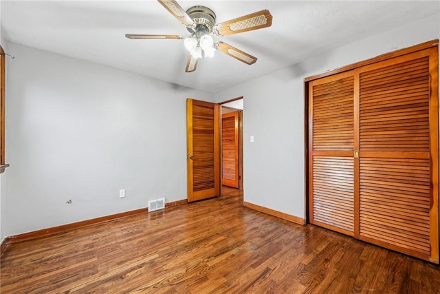 unfurnished bedroom featuring a closet, ceiling fan, and hardwood / wood-style flooring