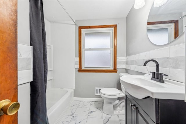 full bathroom featuring vanity, toilet, and shower / bath combo