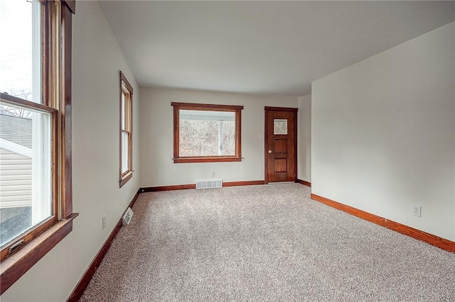 unfurnished room with carpet floors