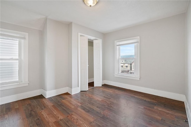 unfurnished bedroom featuring dark hardwood / wood-style flooring