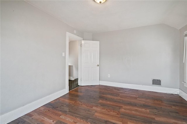 spare room featuring dark hardwood / wood-style floors