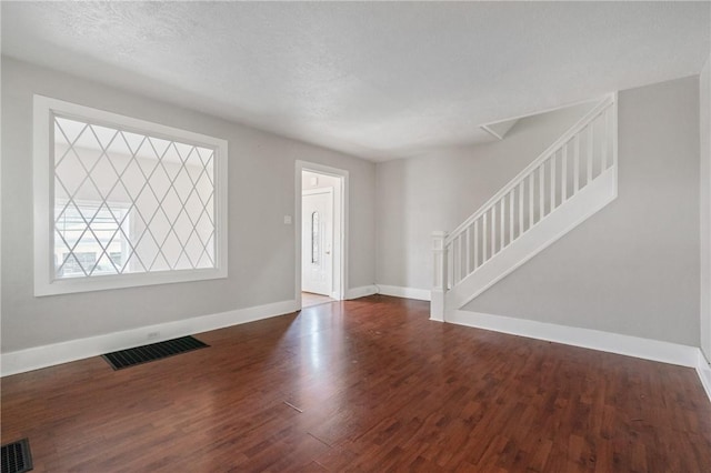 entrance foyer featuring dark hardwood / wood-style floors