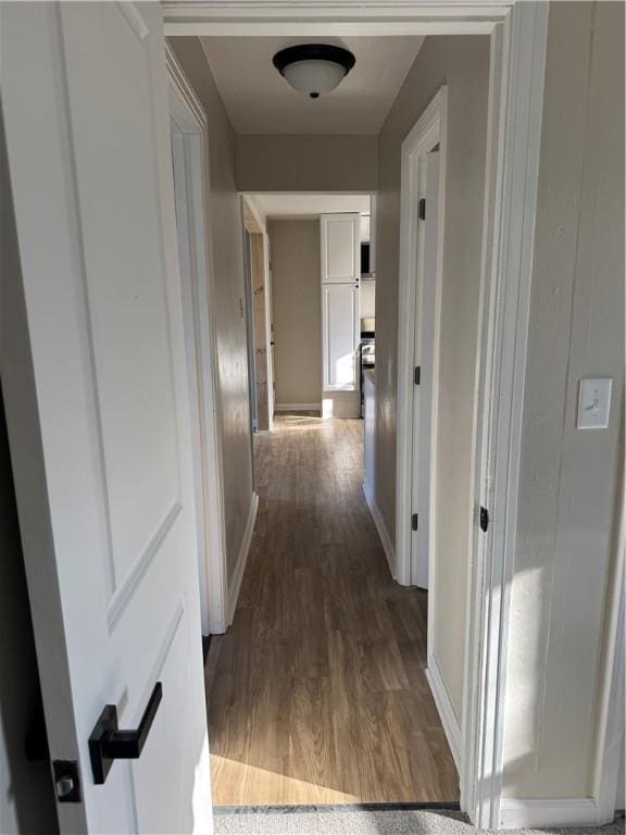 corridor featuring hardwood / wood-style flooring