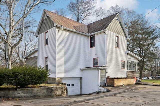 view of home's exterior with a garage