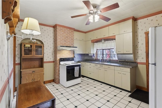 kitchen featuring tasteful backsplash, crown molding, white appliances, and cream cabinetry