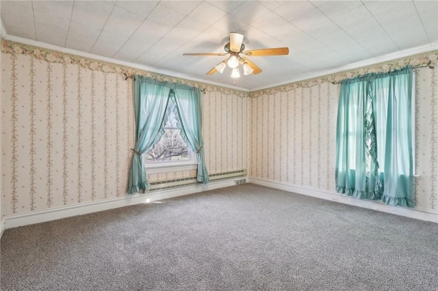 spare room with baseboard heating, crown molding, carpet floors, and ceiling fan