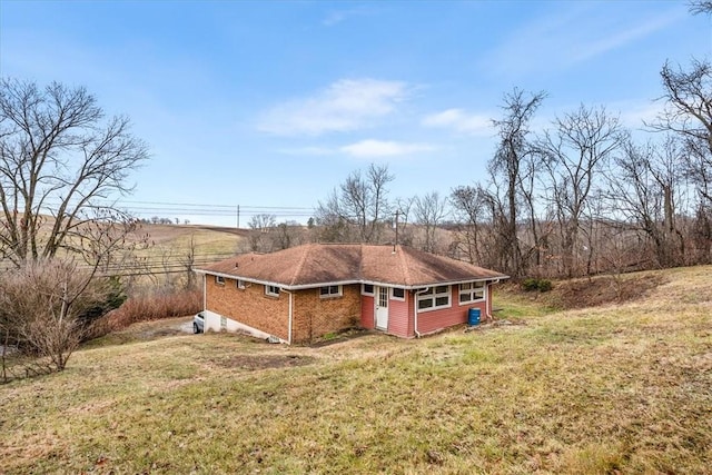 view of property exterior with a yard