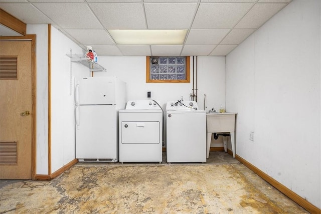 clothes washing area featuring independent washer and dryer