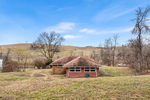 view of yard with a rural view