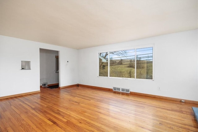 unfurnished room with light hardwood / wood-style flooring