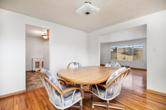 dining area with hardwood / wood-style flooring