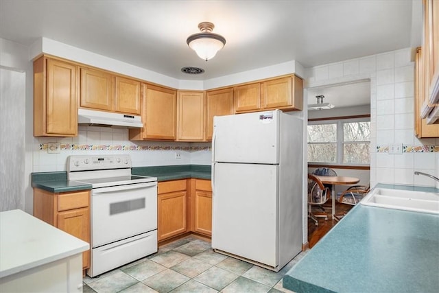 kitchen with decorative backsplash, white appliances, sink, and light tile patterned floors