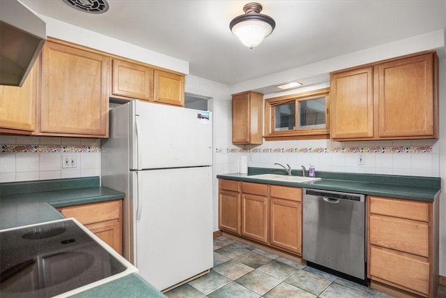 kitchen featuring sink, dishwasher, white refrigerator, stovetop, and decorative backsplash