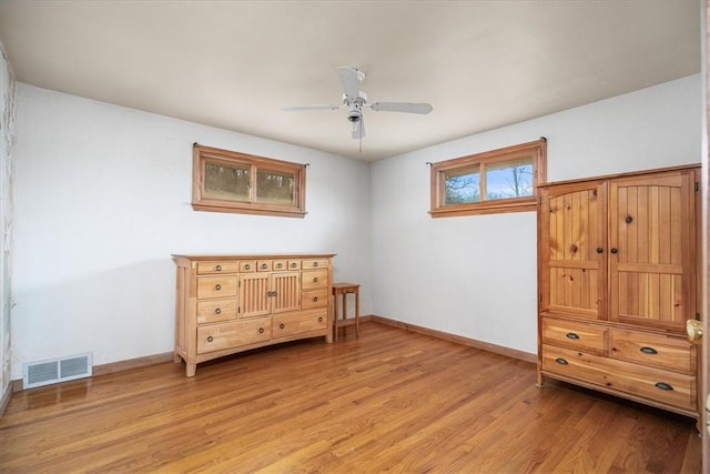 bedroom with ceiling fan and light wood-type flooring