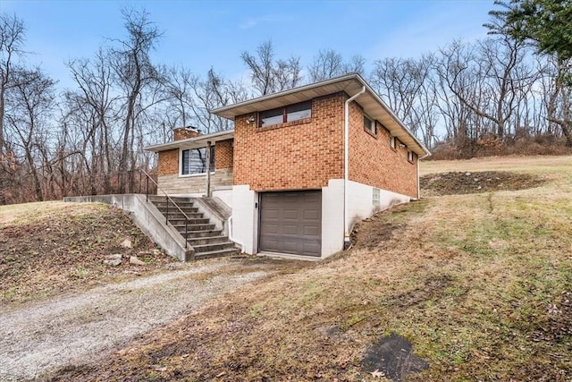 view of side of property with a garage